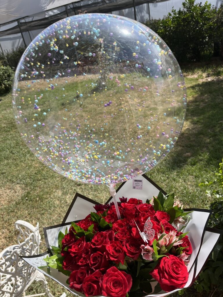 Ramo de 28 rojas con 1 globo cristal